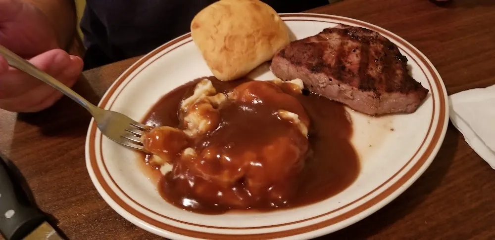 8 Oz Sirloin Steak with a Roll and Mashed Potatoes and Gravy